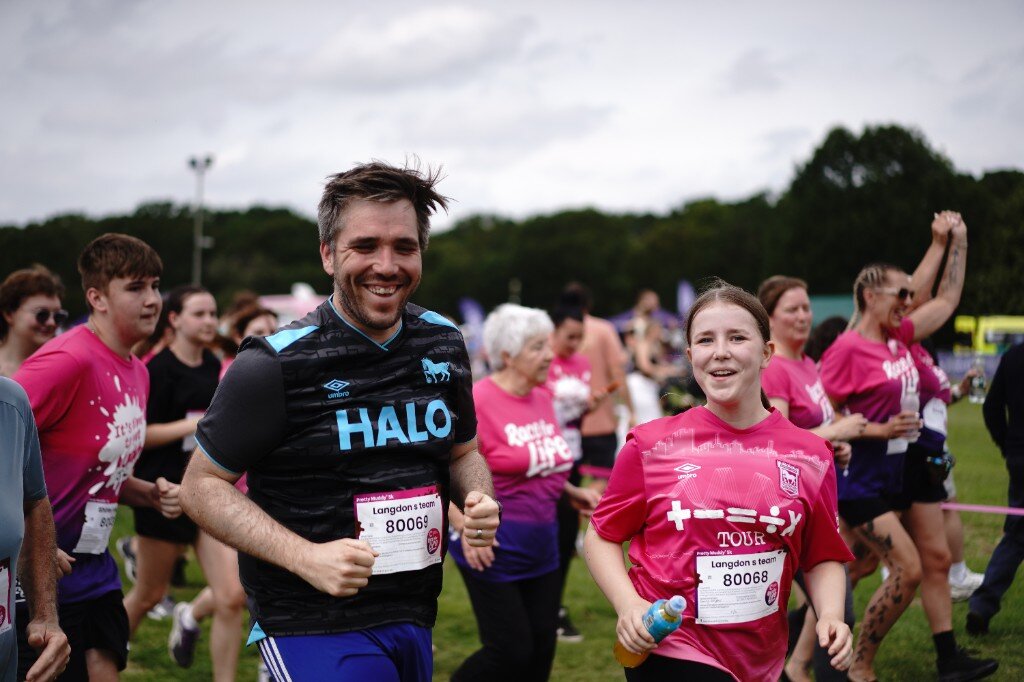 Dave Langdon running Cancer Research UK Pretty Muddy 5k with Langdon’s team — Ipswich greeting card sales agent East Anglia